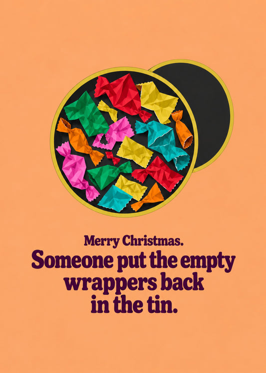 Funny Christmas card showing a sweet tin full of crumpled colourful foil wrappers with the lid off on an orange, by Gigglz