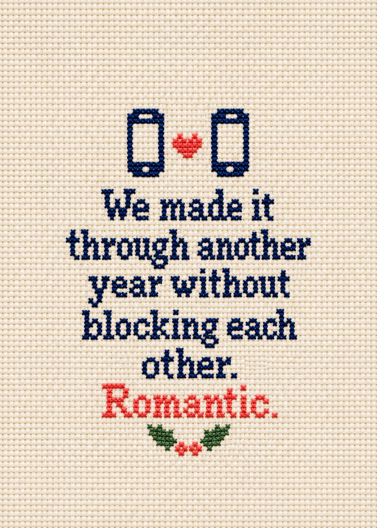 Funny Christmas card showing cross-stitch style navy lettering with two stitched phones, a heart and holly, by Gigglz